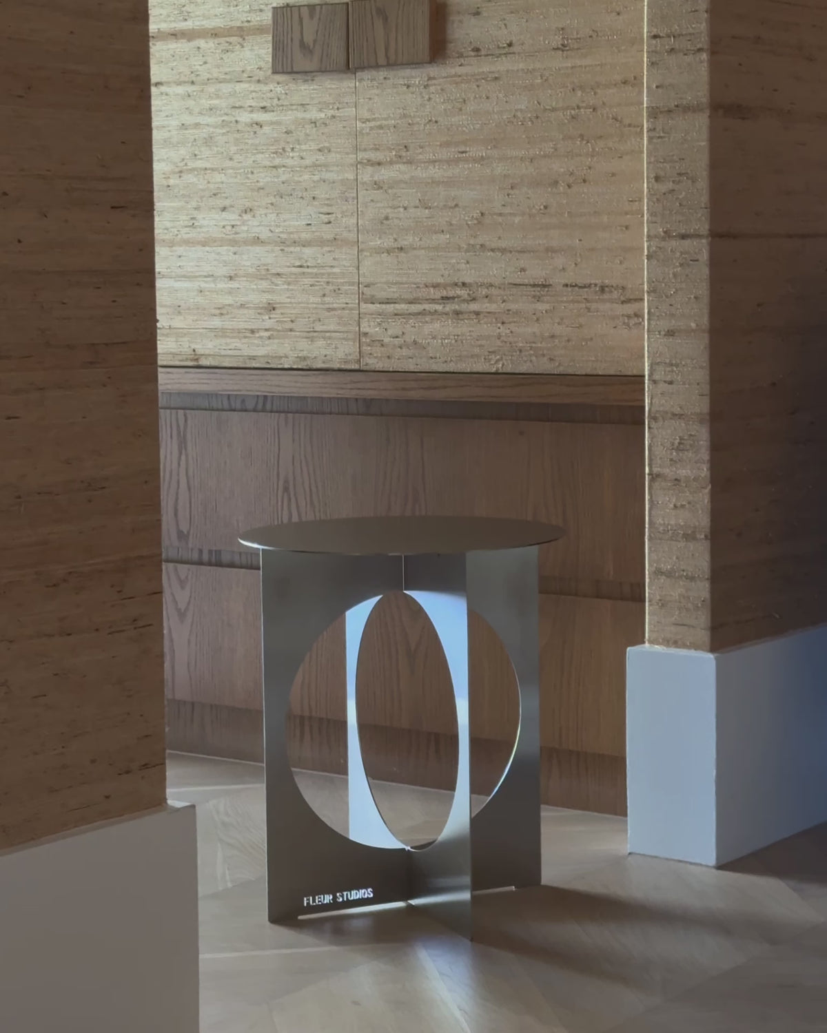 Modern stainless steel side table.